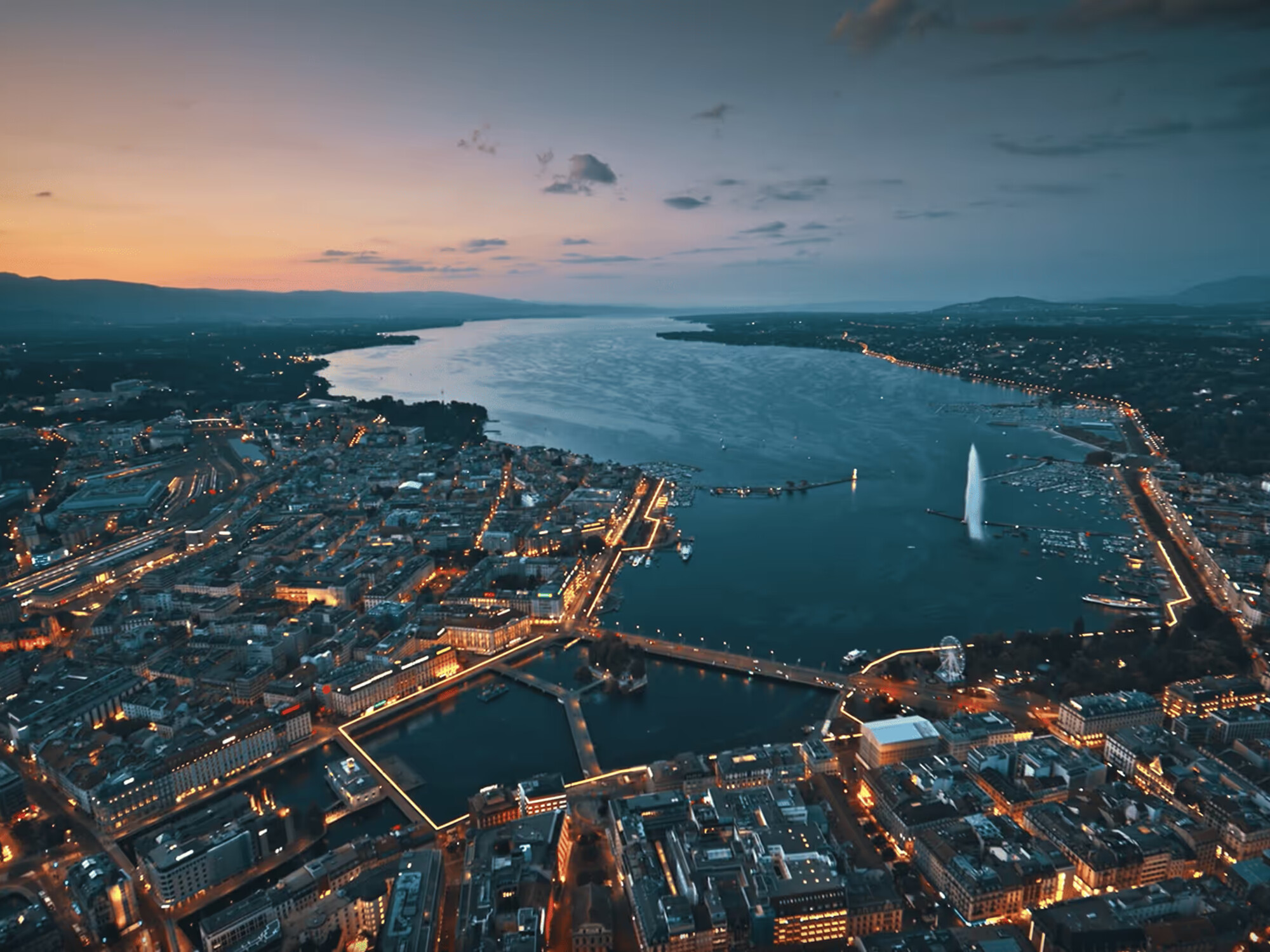 Geneva and Lake Geneva at dusk, photographed from above for Geneva Summit 2026 (Photo: © The Big Whale, Official event photograph)